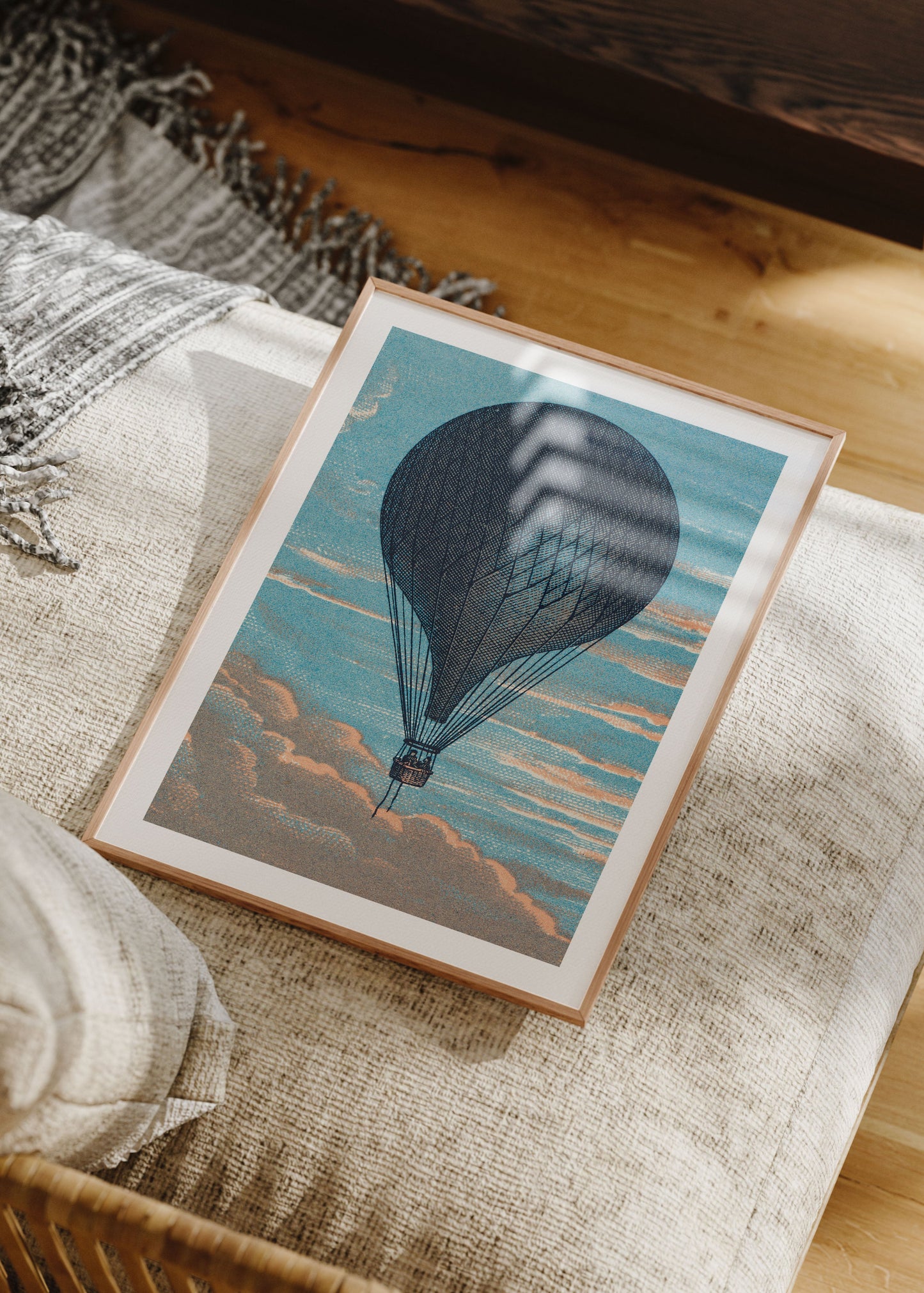 Framed artwork of a hot air balloon on a textured surface